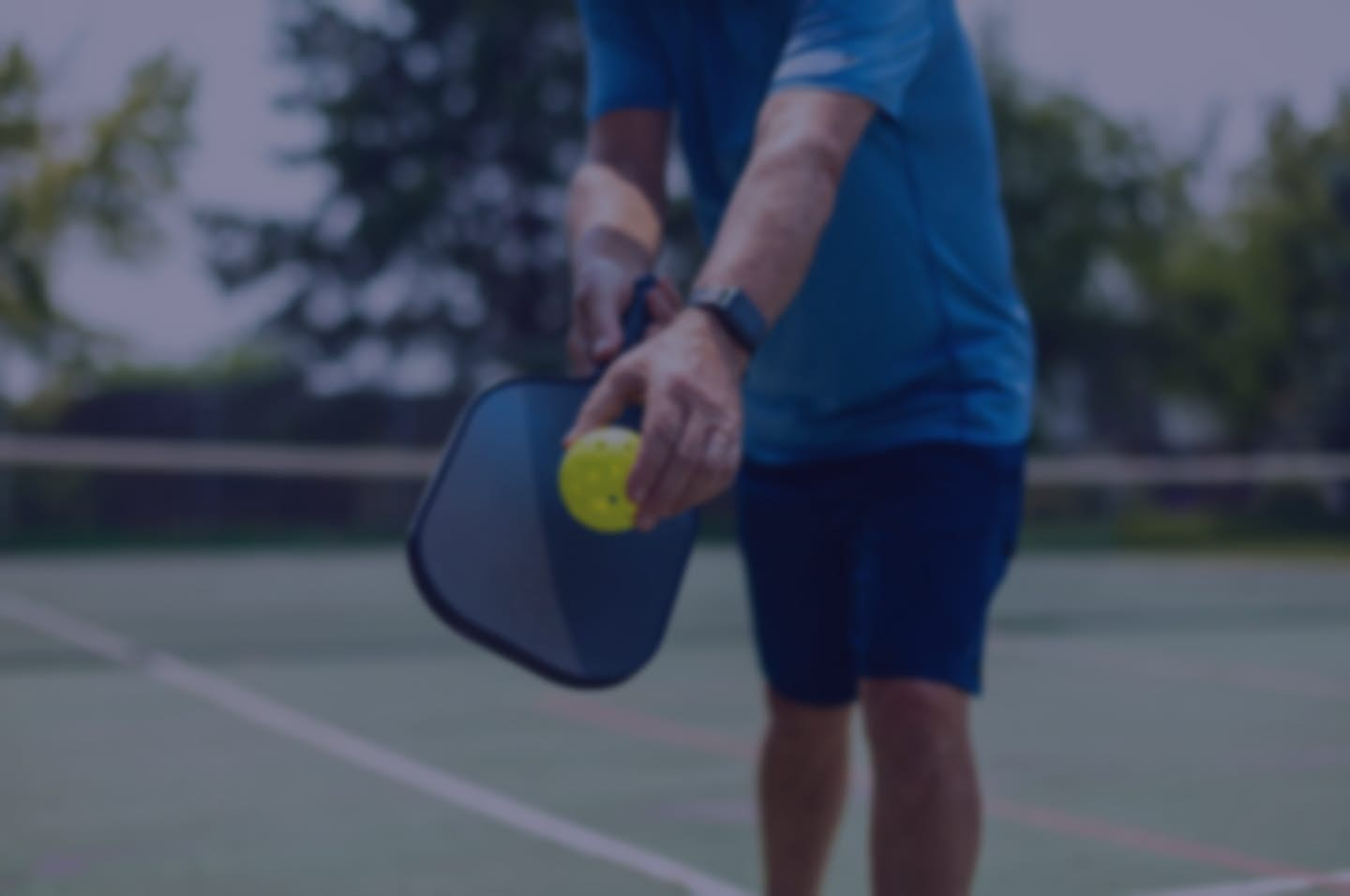 Photo of people playing pickleball