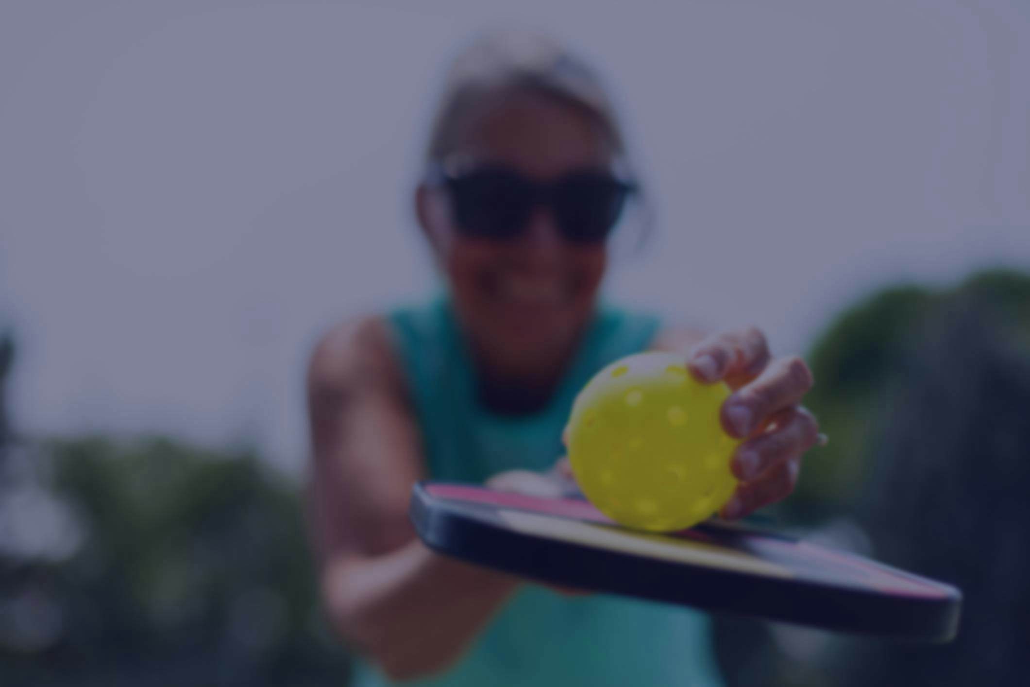 Photo of people playing pickleball